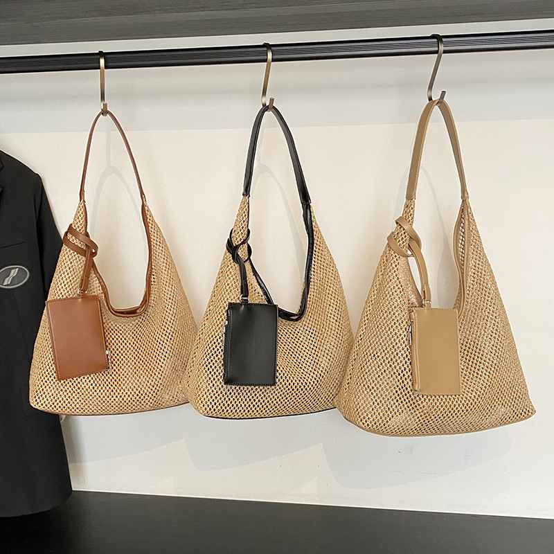 2025 New summer fashion women's hand-held woven bag, fashionable and stylish women's seaside and beach vacation straw woven single-shoulder bag full figure