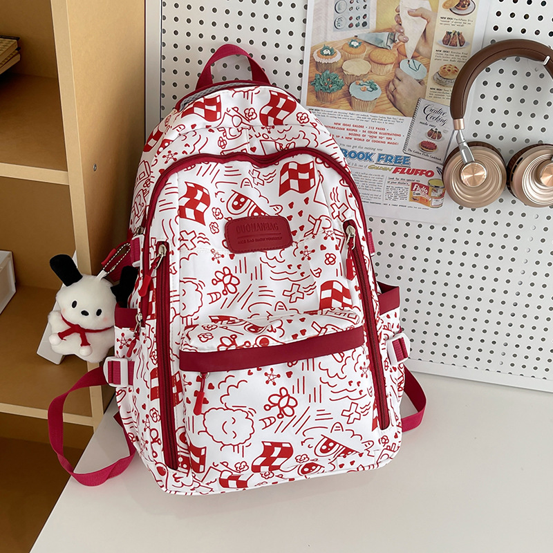 Cross-border schoolbag for junior high school students, large-capacity printed graffiti, niche design backpack, college student travel bag Application Scenario