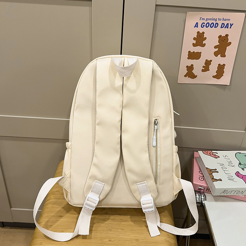 A simple and versatile solid-color backpack for female college students, a fresh and lightweight wide-shoulder backpack for junior and senior high school students Specification drawing