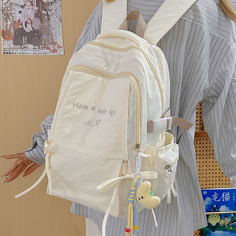 New casual backpacks for boys and girls, large-capacity and low-load backpacks, simple letter schoolbags for high school and junior high school students, cross-border details Picture