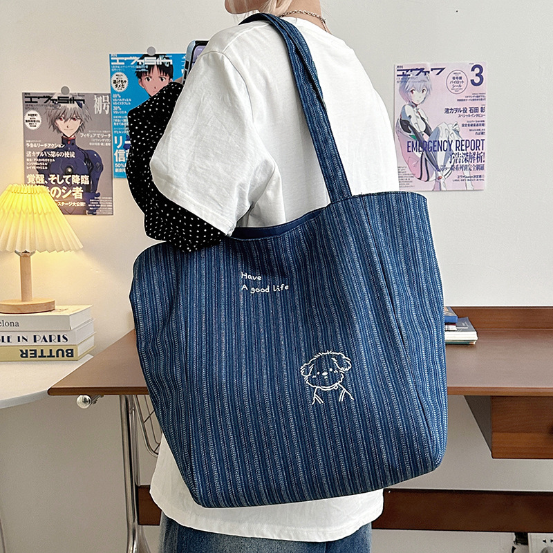 This 2025 new denim bag features embroidered canvas on both sides and is a Korean-style Instagram tote casual single-shoulder bag with a large capacity Application Scenario