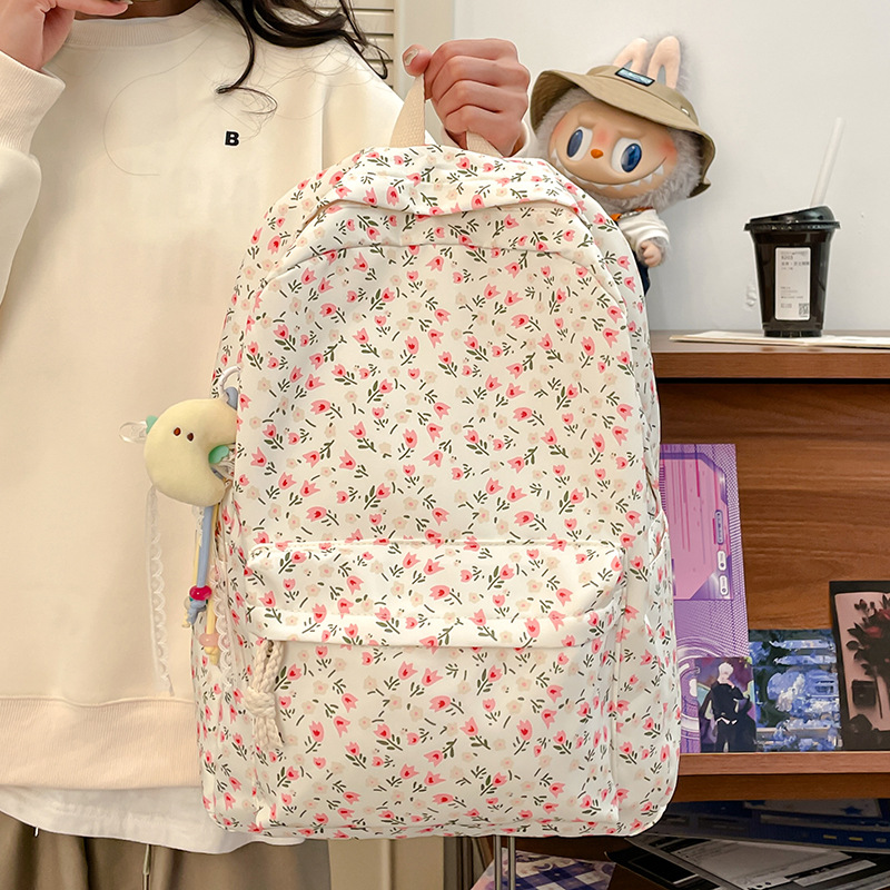 A cute Japanese-style double-shoulder backpack for junior and senior high school students, a floral puppy backpack for college students, and a large-capacity schoolbag details Picture