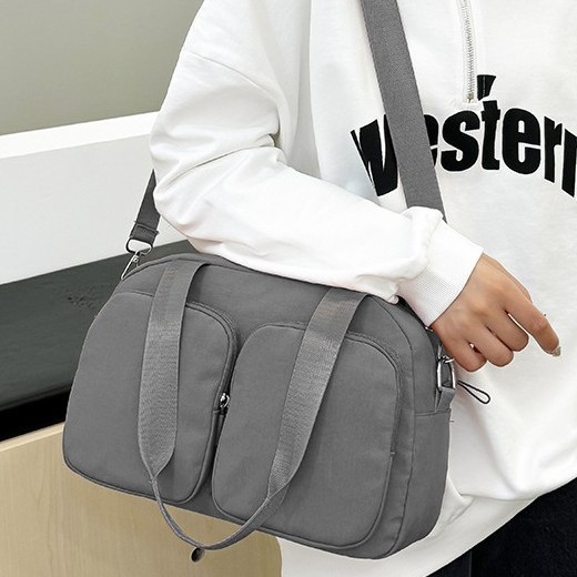 Korean version large-capacity hand-held versatile women's bag, travel bag, short-distance solid-color fashionable casual light shoulder bag, crossbody bag Specification drawing