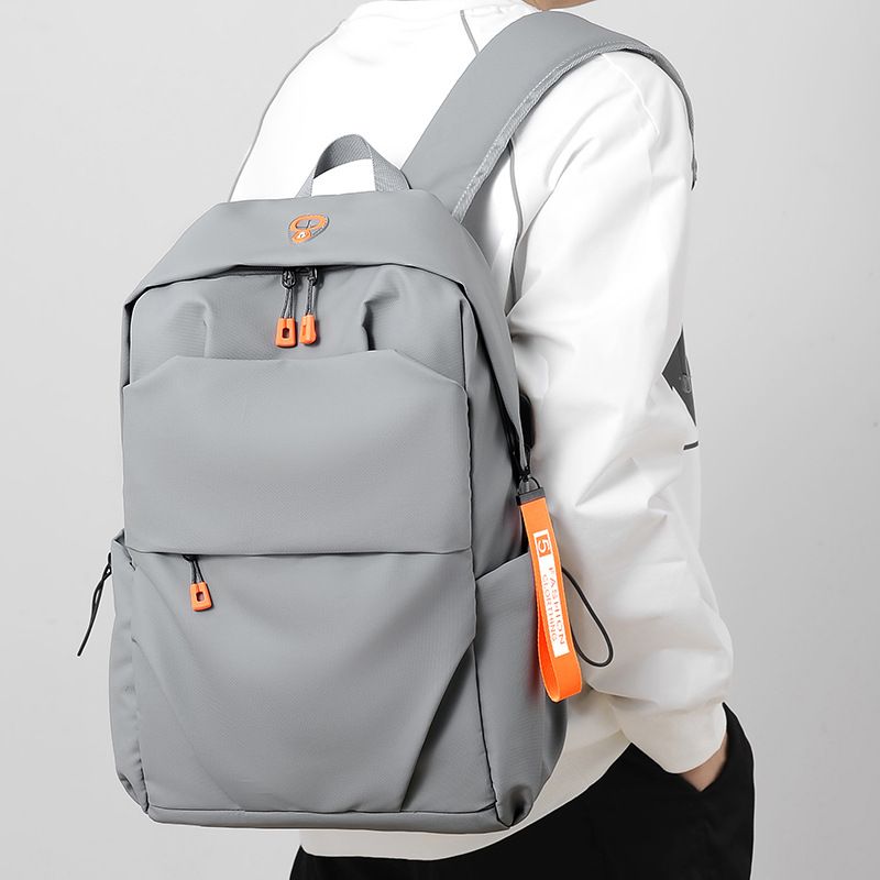 Wholesale of men's casual and trendy backpacks, computer bags, travel large-capacity backpacks, and school bags for junior high school, senior high school and college students full figure