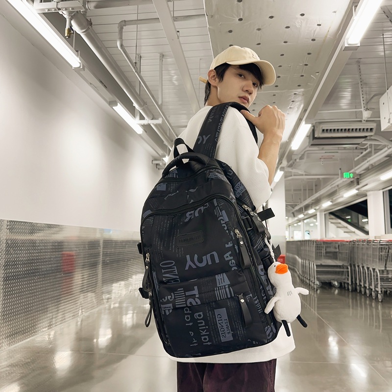 2024 New style schoolbag for boys, graffiti, cool, large capacity, high appearance level, backpack for girls, college students, couple backpack details Picture