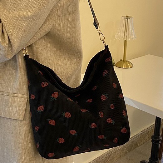 The 2024 new casual and fashionable commuter bag for women is a versatile and cute strawberry wide shoulder strap single-shoulder bucket bag full figure