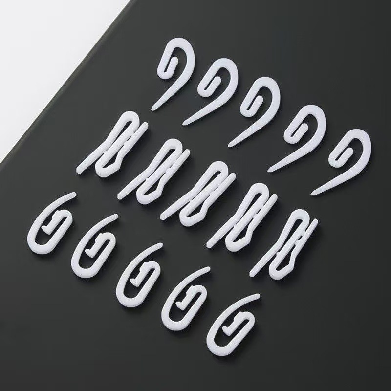 The manufacturer wholesals curtain hooks, small pointed hooks, curtain fabric tape hooks, white plastic hooks and curtain ring accessories full figure