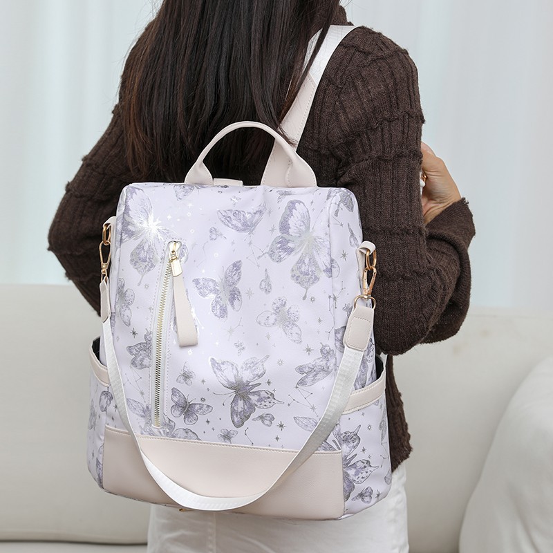 The new printed backpack is a fashionable large-capacity hand-held shoulder bag for women. It is a casual travel backpack and very cute full figure