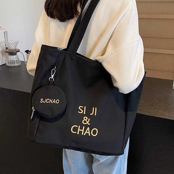Large-capacity class single-shoulder commuting versatile bag, tutorial bag, hand-held canvas bag, student tutorial and work commuting bag full figure