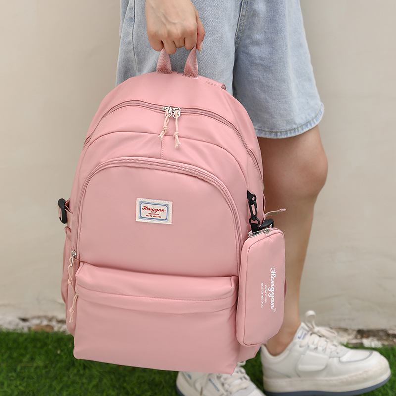 Wholesale of new Korean-style casual large-capacity backpacks for foreign trade students, including school bags for junior and senior high schools and outdoor travel bags Application Scenario
