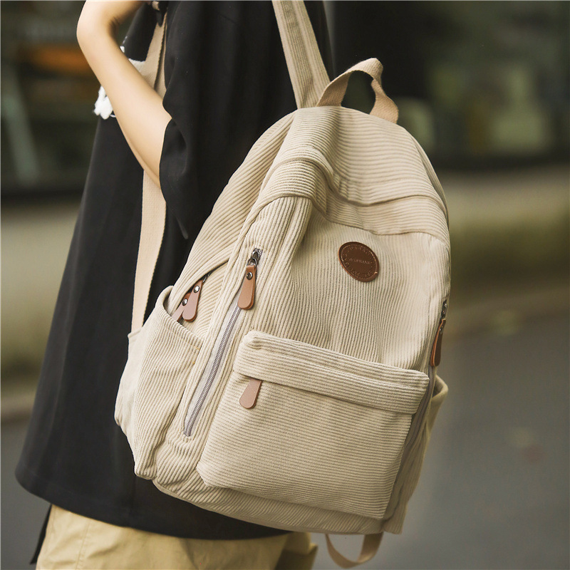 The new corduroy backpack for autumn and winter 2024 is a solid color versatile large-capacity backpack suitable for both men and women Application Scenario