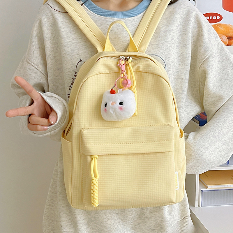 Cross-border fresh and clean campus schoolbags, simple backpacks for junior high school and college students, solid-color backpacks, commuting and travel backpacks Application Scenario