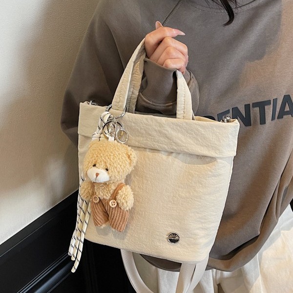 A new solid-color sporty and fashionable handbag from a trendy cartoon style, simple and water-resistant, casual and lightweight single-shoulder crossbody bag Application Scenario