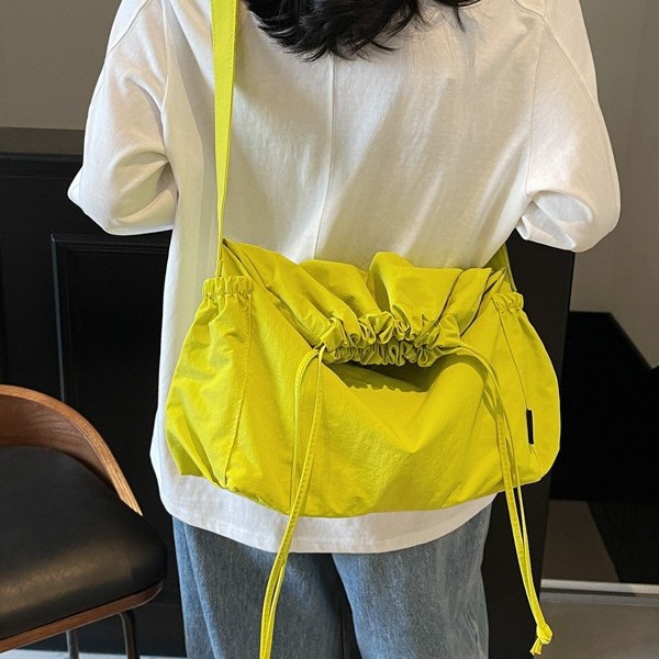 Couple style drawstring crossbody bag, large capacity folding messenger bag, unisex wandering bag, solid color casual single-shoulder bag full figure
