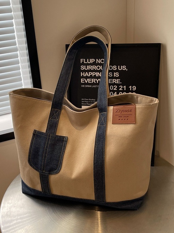 A new large-capacity tote bag for women, a color-blocking canvas bag, a casual and simple hand-held shoulder bag, and a fashionable underarm bag full figure