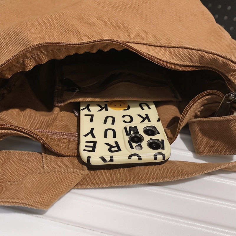 Canvas dumpling bag 2024 New style ins single-shoulder bag for women, laid-back casual crossbody bag, solid color retro small backpack Application Scenario