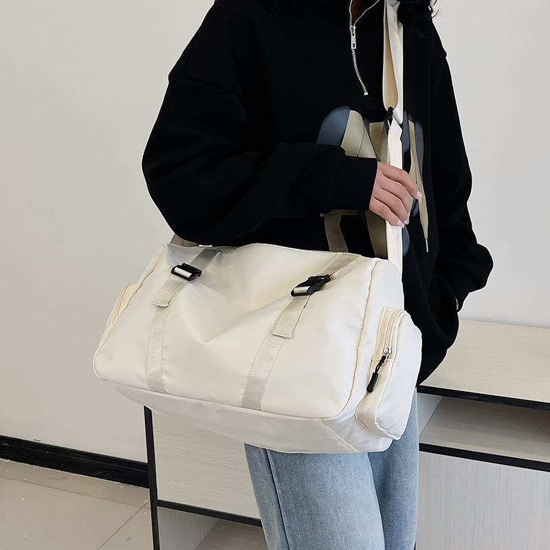 Wholesale short-distance travel bags for foreign trade, large-capacity travel bags for men and women on business trips, simple and convenient side-pocket sports and fitness bags details Picture