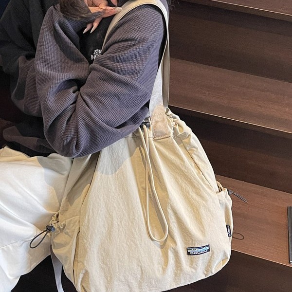 New Spring 2025 tapered casual single-shoulder bag with large capacity, suitable for both men and women, Korean version student backpack Application Scenario