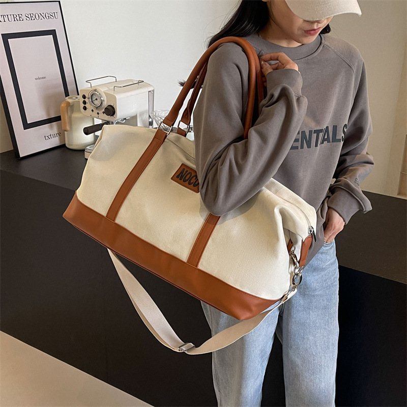 Wholesale of Korean-style hand-held travel bags, short-distance large-capacity luggage bags for men and women, fashionable and casual canvas yoga and fitness bags details Picture