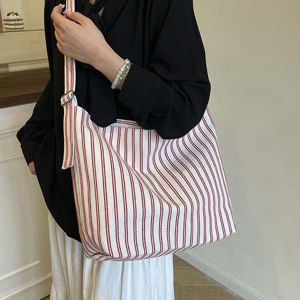 A fresh and elegant outdoor casual bag with a large capacity, multi-color vertical stripes, light and simple underarm single-shoulder bag and women's tote bag details Picture