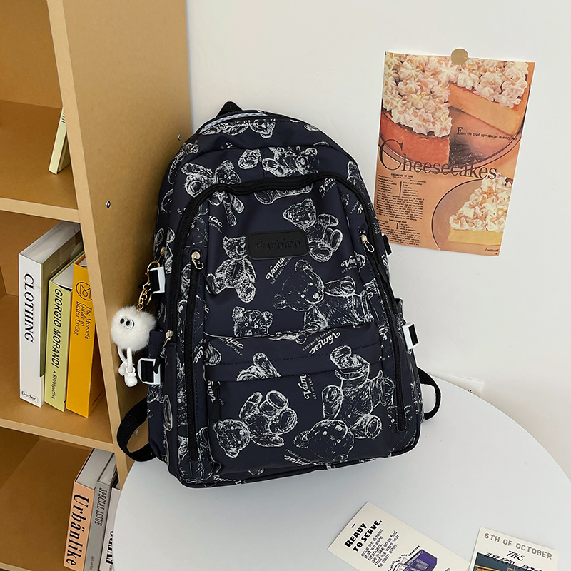 Large-capacity schoolbag for girls in high school, laid-back style, dirt-resistant, university campus class bag, ins bear nylon backpack Application Scenario