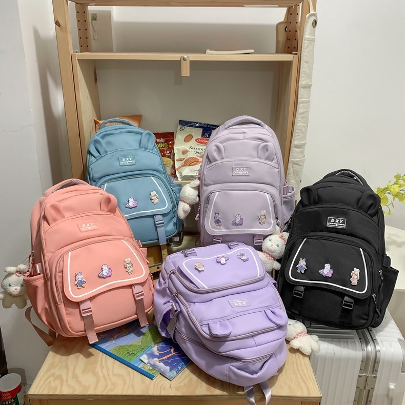New simple and trendy middle school schoolbag, solid-color outdoor casual backpack, Korean-style nylon cartoon backpack for girls details Picture