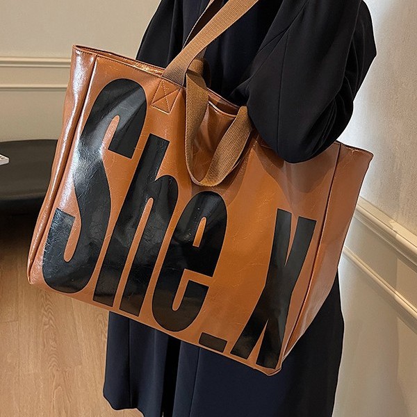 A new large-capacity hand-held women's fashionable Korean-style commuting bag for autumn and winter, a high-end textured tote bag with large letters and European and American style Specification drawing