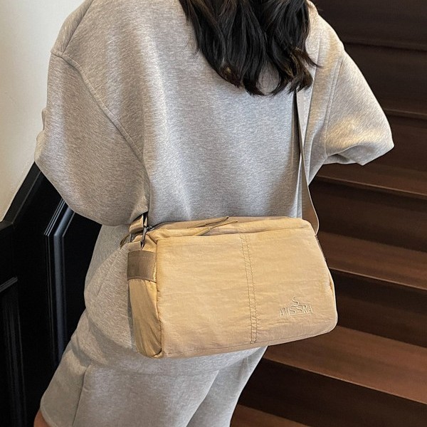 Cross-border crossbody bag, solid color storage bag, ultra-light fabric bag, water-resistant walking bag, simple small square bag, high appearance level crossbody bag Application Scenario