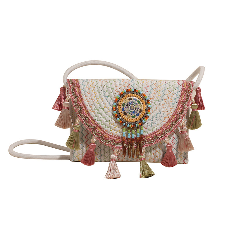 Spring new casual woven bag, straw woven bag, hand-held ethnic style niche crossbody bag, tassel texture single-shoulder bag Item Picture