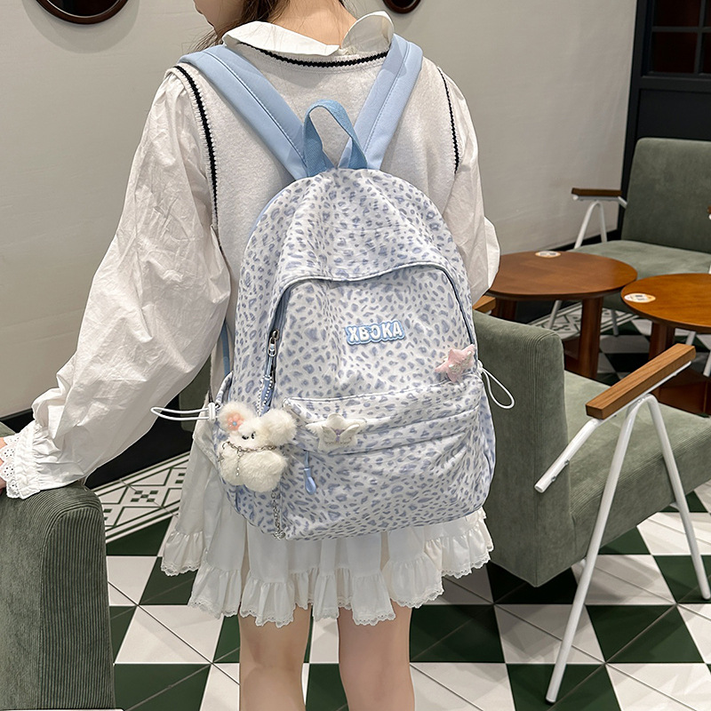 The new small schoolbag, a forest-themed floral print mini backpack for high school students, is a versatile and refreshing backpack for young girls details Picture