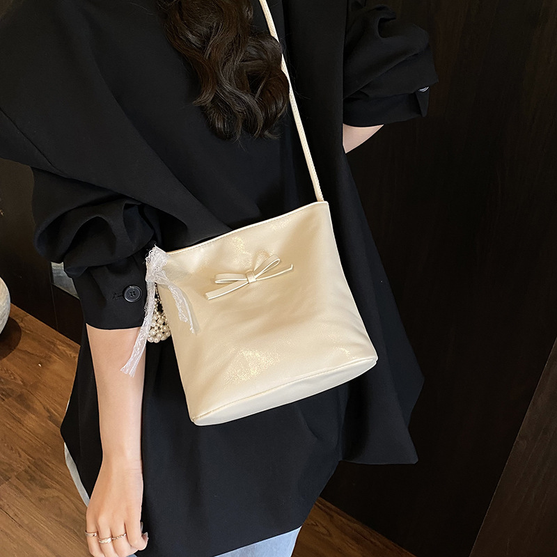 Korean style fashion niche bow hand-held bucket bag for women 2025 new summer, high-end and versatile single-shoulder underarm bag Specification drawing
