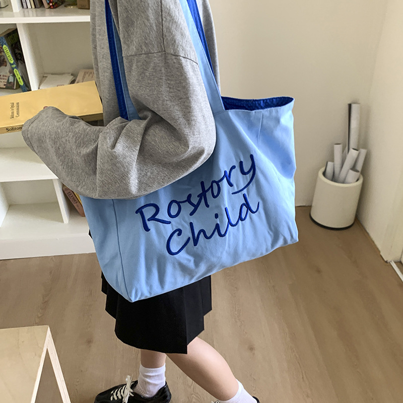 A trendy large-capacity tote bag for women, a new high-end textured embroidered single-shoulder canvas bag for student commuting in summer 2025 details Picture