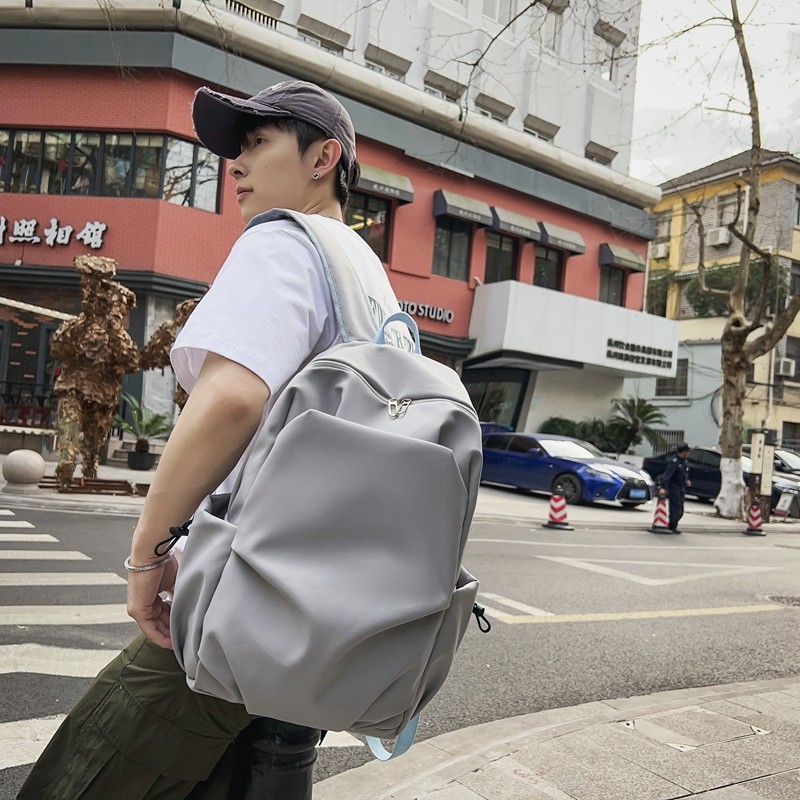 Multi-functional solid-color casual backpack for male and female college students, simple large-capacity backpack, laptop bag Application Scenario