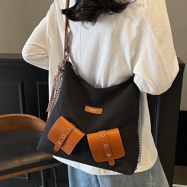 A new, fashionable, individualistic and niche design hand-held bucket bag, a simple and trendy spring commuter crossbody bag for women Specification drawing