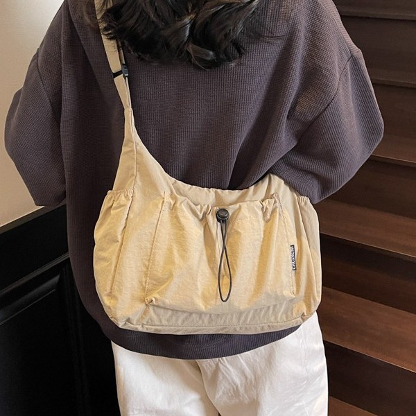 A new style of Korean niche casual, versatile, drawstring, lightweight nylon fabric bag with large capacity, single-shoulder bag, women's bag and crossbody bag Application Scenario