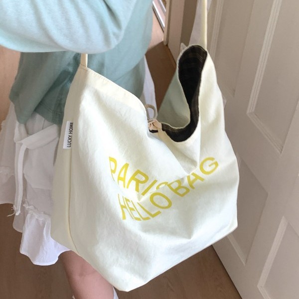 Korean version 2025 canvas tote bag, artistic and retro, large-capacity letter single-shoulder bag, double-sided dual-purpose crossbody bag, trendy Application Scenario