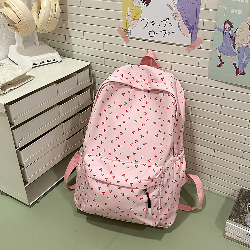 Korean-style fresh and simple schoolbag for female college students with small floral prints, lightweight and large-capacity backpack for high school students Application Scenario