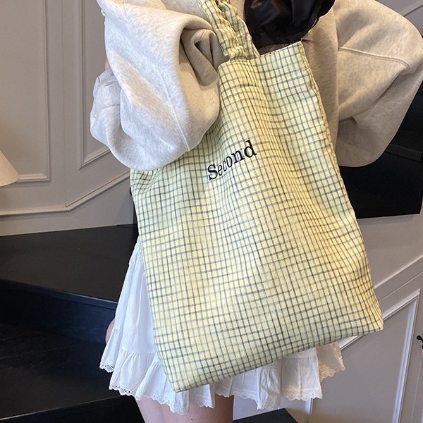 Korean checkered pattern spring and summer design simple embroidered letter stripe fabric bag for women, ins pleated versatile shoulder bag Application Scenario