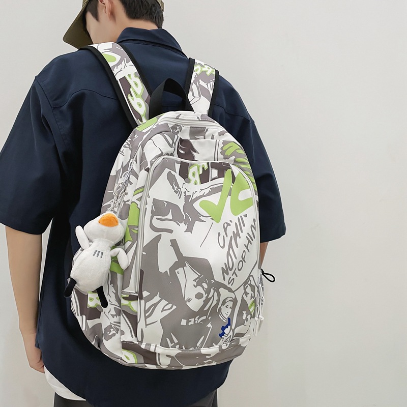 Fashionable graffiti printed schoolbag for girls, cool and trendy ins Japanese Harajuku style backpack, simple college student high school backpack full figure