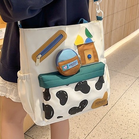 The new autumn 2024 collection features a cute single-shoulder crossbody bag with cow print, a student handbag, and a fun children's tutorial bag with a large capacity full figure