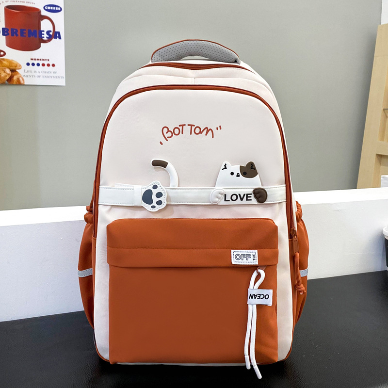The new nylon schoolbag has a high appearance level. It is a multi-layered casual backpack with cute cats for middle school students details Picture