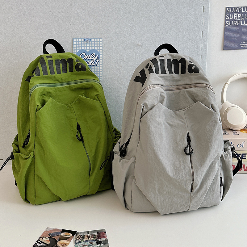 Cross-border trendy and cool backpacks for couples, Korean style, high appearance level, new casual travel backpacks, high school and college student schoolbags full figure