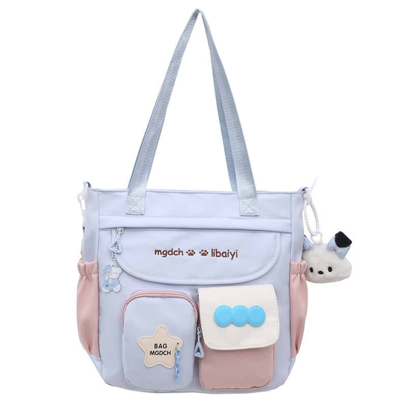 The new schoolbag for women is a large-capacity crossbody bag with a contrasting color for students. It is versatile, reduces the burden, and is fashionable and trendy with a cartoon single-shoulder design Item Picture