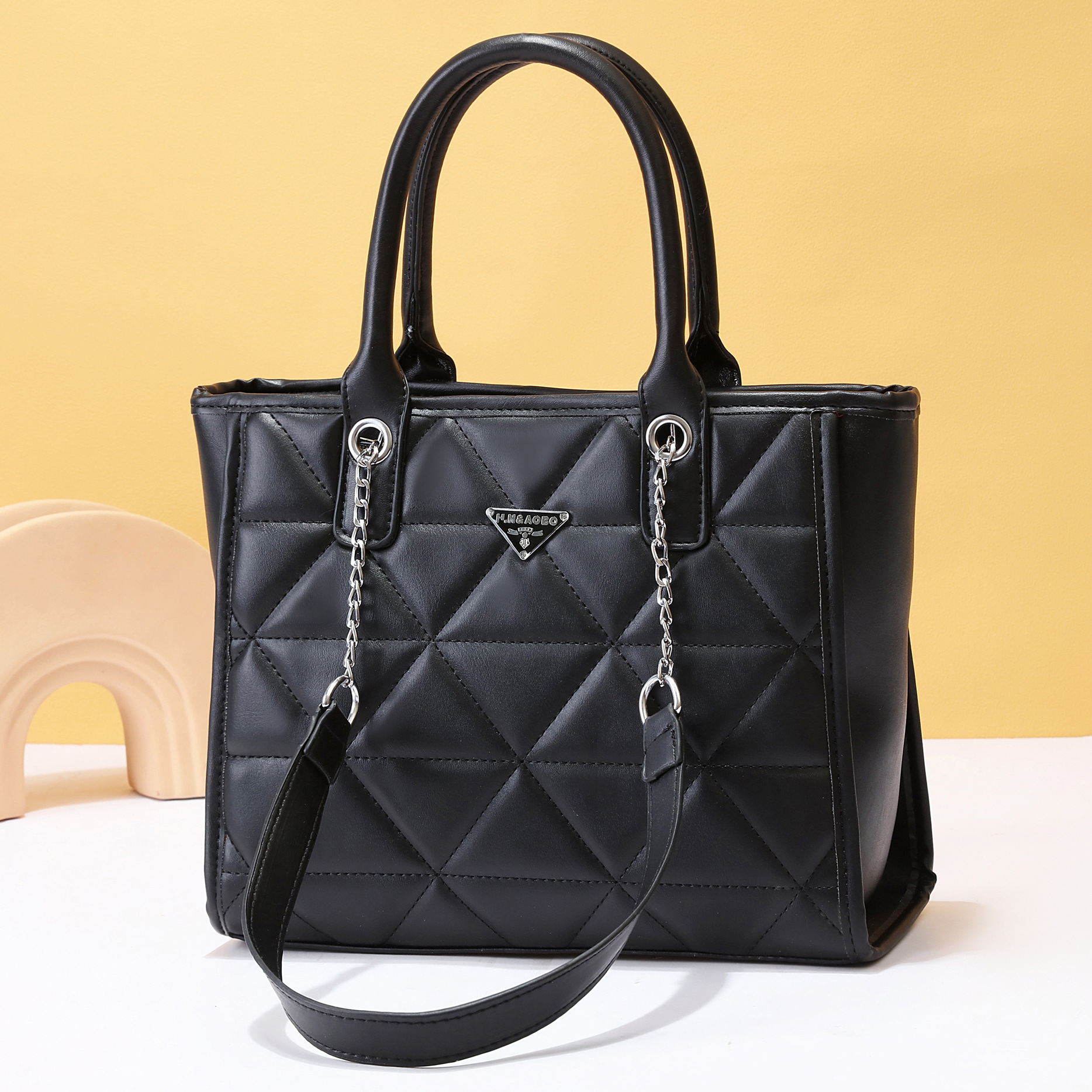 The 2023 new stylish large-capacity hand-held tote bag, with its embroidered and stylish style, is a single-shoulder crossbody bag for women's cross-border travel full figure