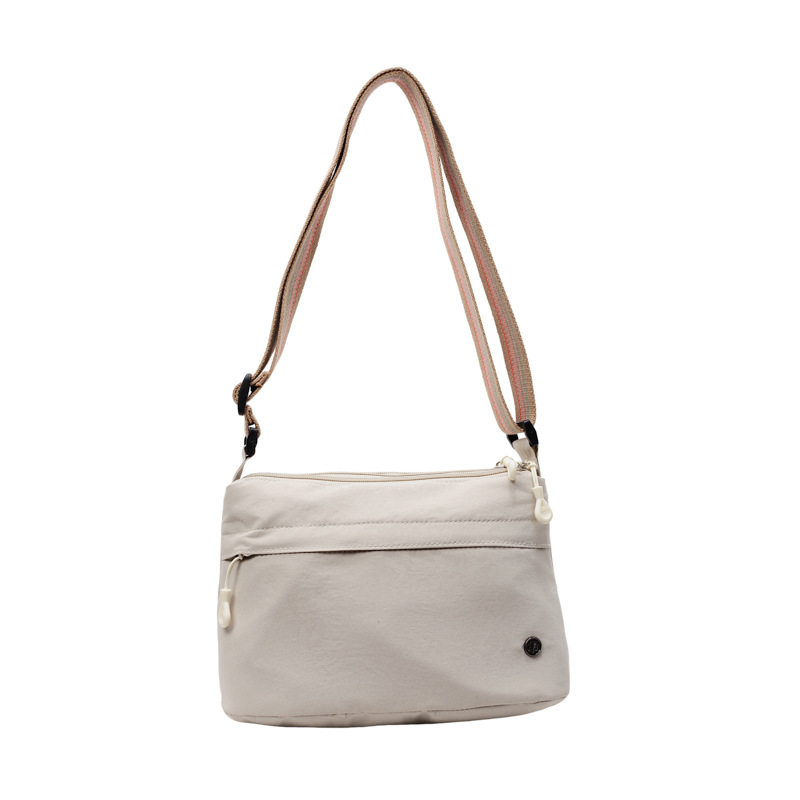 The 2025 new women's crossbody bag is a lightweight fabric small bag with a light and casual single-shoulder design. It is simple and versatile on one shoulder Item Picture