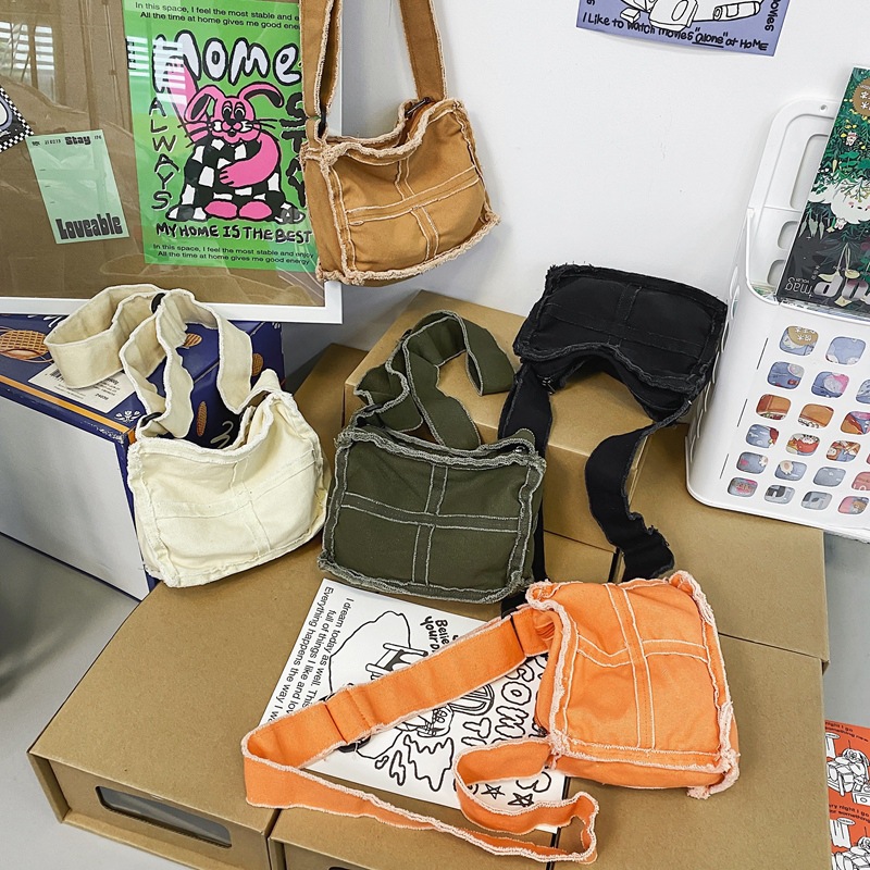 Japanese-style washed canvas bag for women, solid color, casual and niche single-shoulder crossbody bag, with unique fringed stitching and artistic mobile phone bag Specification drawing
