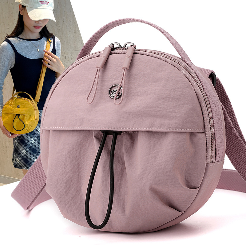 Nylon lightweight commuter crossbody small round bag 2024 Autumn new style single-shoulder bag, Japanese simple hand-held women's bag full figure