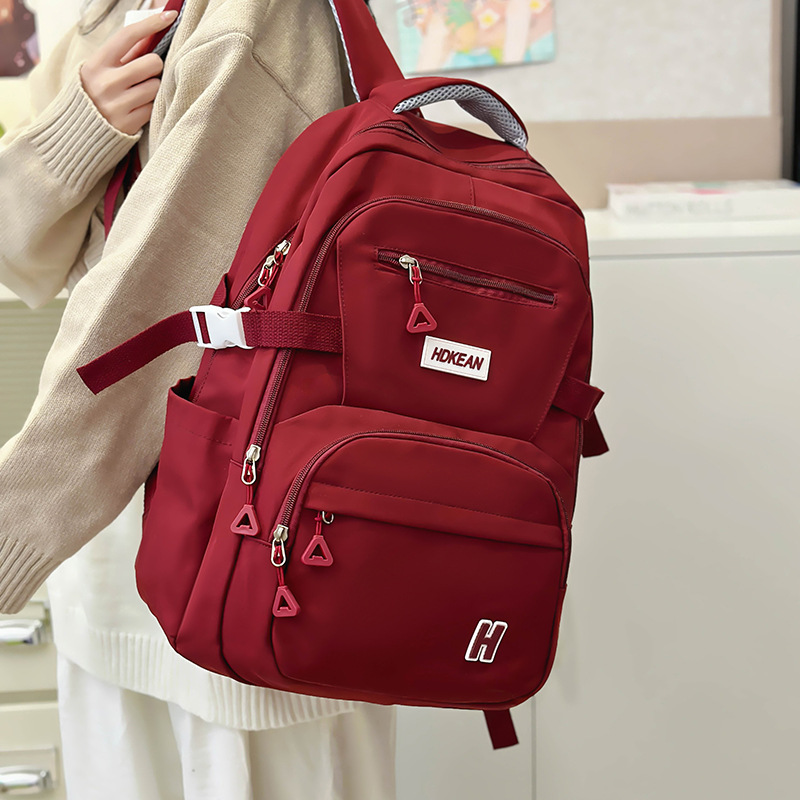 The 2024 new large-capacity backpack for high school students with multiple compartments and wide shoulder straps for primary and secondary school students is versatile for men full figure