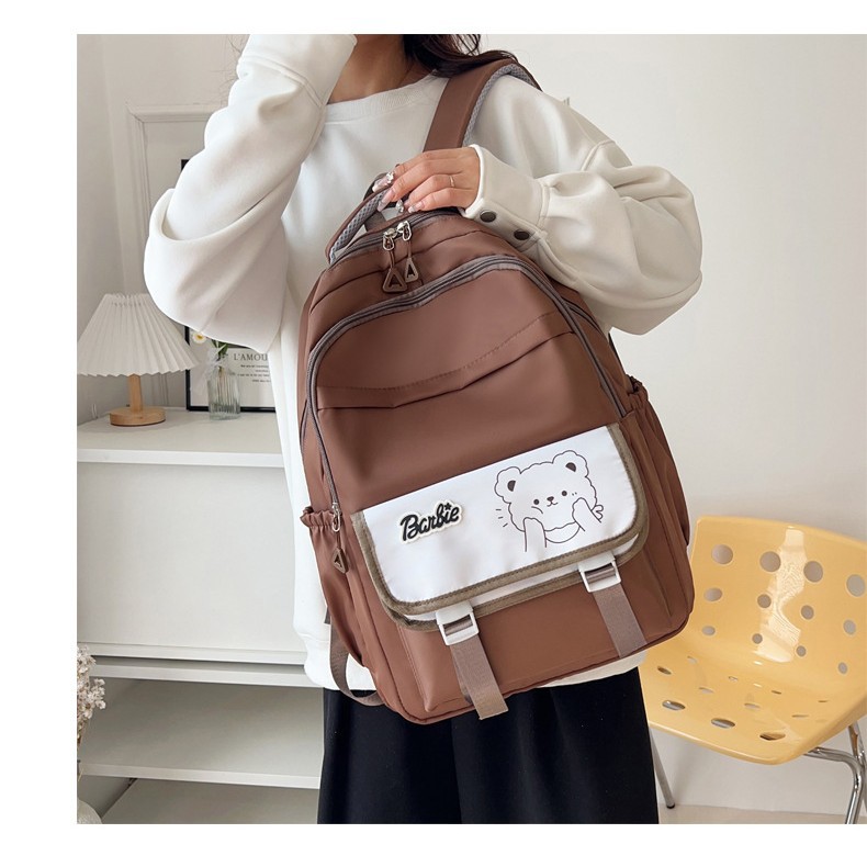The 2025 new style of simple and cute large-capacity backpack is a lightweight and weight-reducing schoolbag for grades three, four and five, as well as for junior and senior high school students details Picture