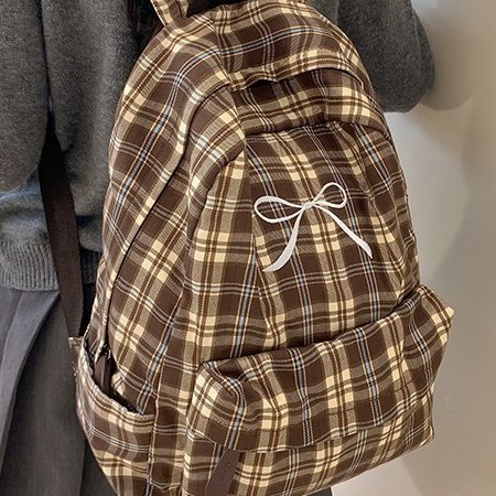 The new large-capacity backpack with a checkered pattern and a fresh and cute school style, the lightweight backpack, and the new forest-themed bag for autumn and winter Application Scenario